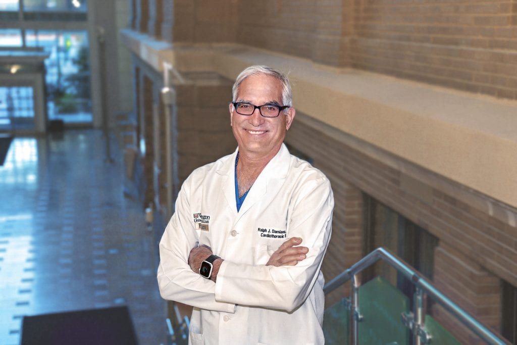 Dr. Damiano wearing white lab coat on stairs at Washington University School of Medicine