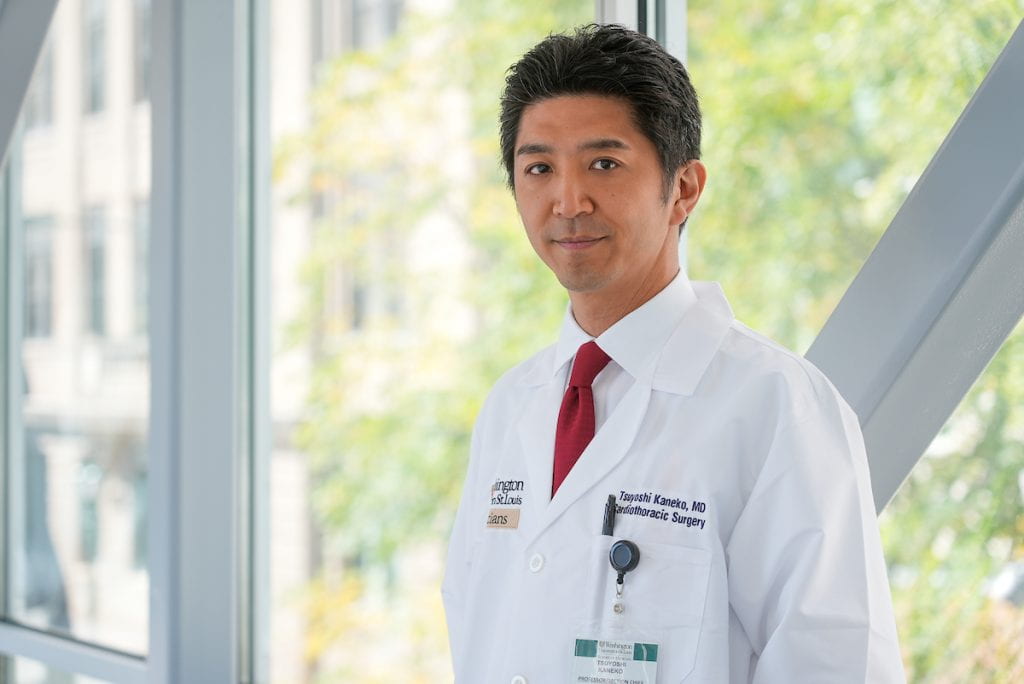 Dr. Kaneko in white lab coat at Washington University School of Medicine